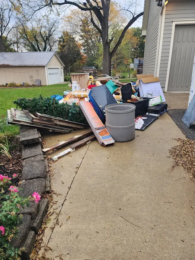 Dumpster being loaded with debris for Residential Dumpster Rental in Henryetta